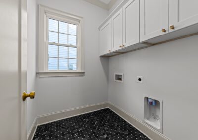 1402 Mordecai Drive by Urban Building Solutions laundry room